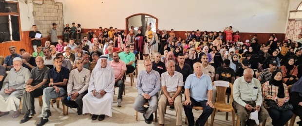  اللجنة الشعبية للاجئين بمخيم المغازي تنظم معرض بصمة أمل رغم الألم